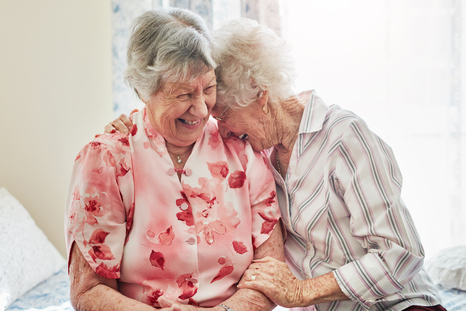 Shot of two happy elderly women spending time with each other at home