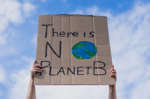 Group of demonstrators on road. Activists protesting on social issues. Race fight and climate change protesting activist during lockdown. global warming and environmental issues. Activists protesting on the street. Group of protestors race fight clim