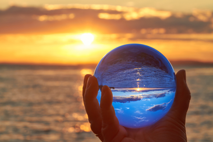 The sun sets over Lake Constance in Germany and lit by a crystal ball.